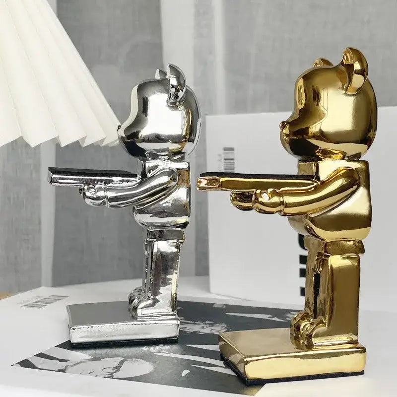 Two glossy gold and silver bear statue watch racks in a stylized standoff pose for bedroom storage display