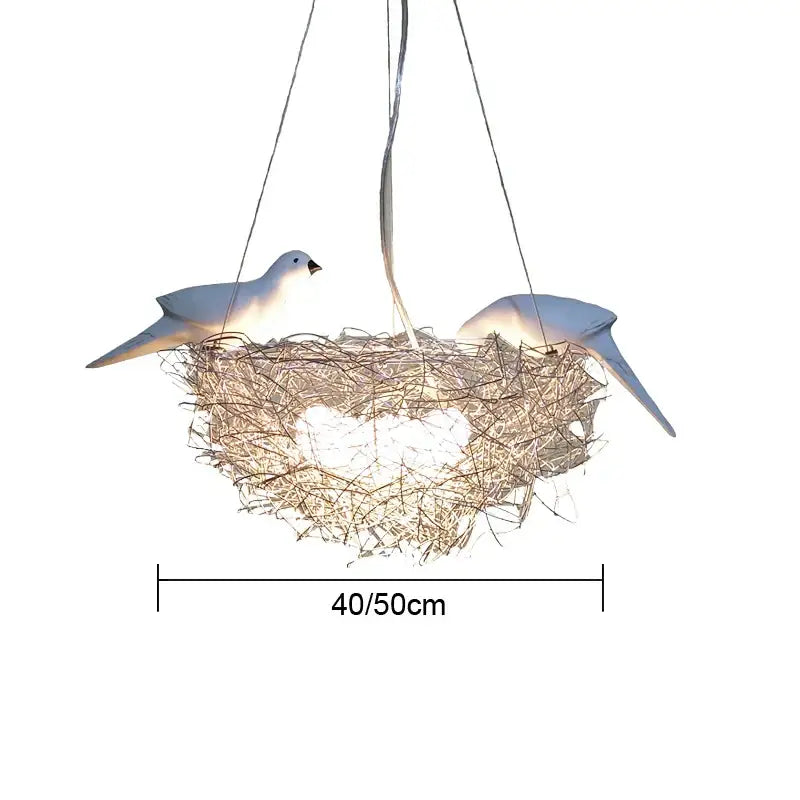 Gold and silver bird’s nest pendant lights featuring woven texture and white dove sculptures for dining room lighting