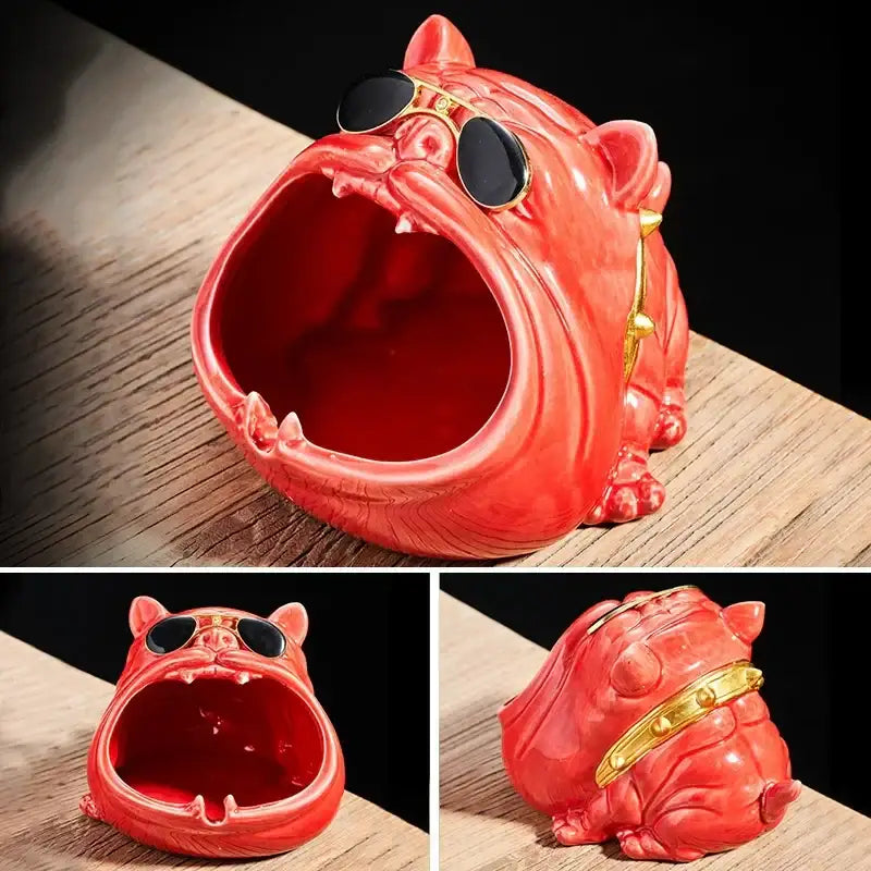 A vibrant red decorbites bulldog ceramic ashtray with gold-trimmed sunglasses in a yawning pose for office decor