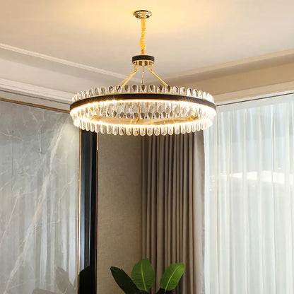 A modern gold stainless steel crystal chandelier with teardrop crystals for dining room decorbites gold stainless design