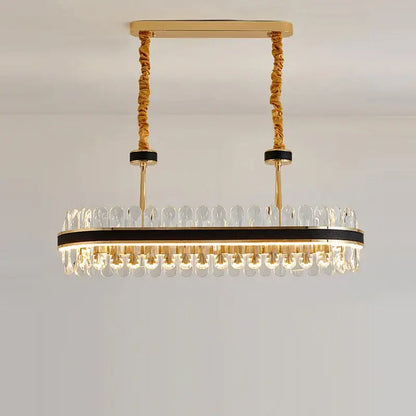Gold stainless steel crystal chandelier oval with clear crystal droplets and black accents for dining room decorbites gold stainless