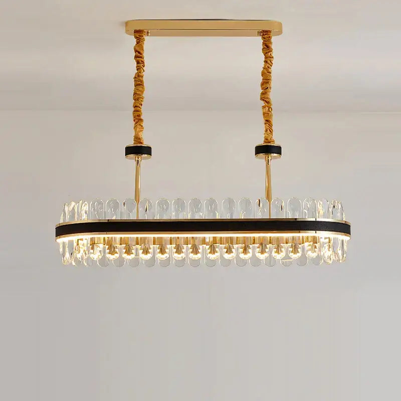 Gold stainless steel crystal chandelier oval with clear crystal droplets and black accents for dining room decorbites gold stainless