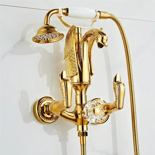 Gold swan bathtub faucet set with gold-finished swan design, crystal knob, and white ceramic handle by decorbites