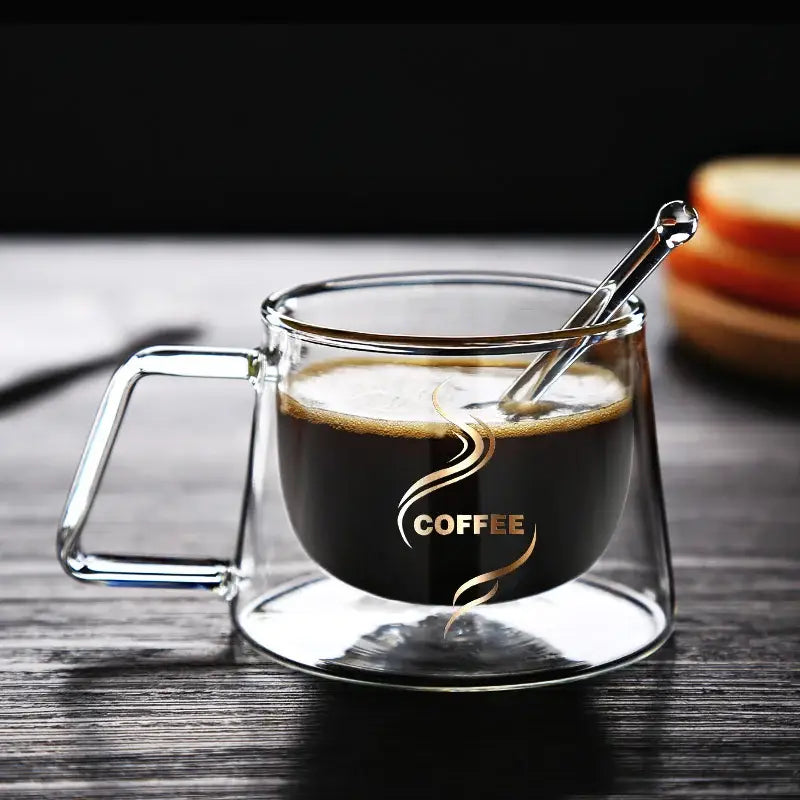 Gold swirl glass double wall coffee mug with transparent handle and base featuring gold coffee logo decorbites glass double
