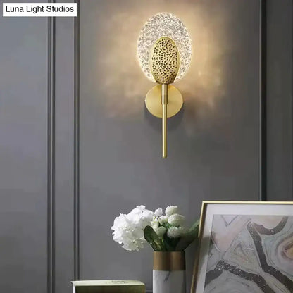 Gold-toned led wall lamp with textured glass shade and leopard-print metal accent for indoor lighting