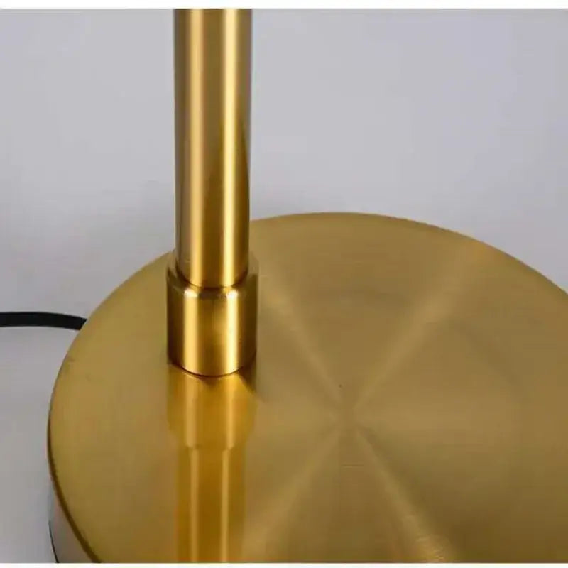 Brass-finished gold vintage industrial desk lamp base with sleek cylindrical stem and circular platform for bedroom decorbites gold vintage