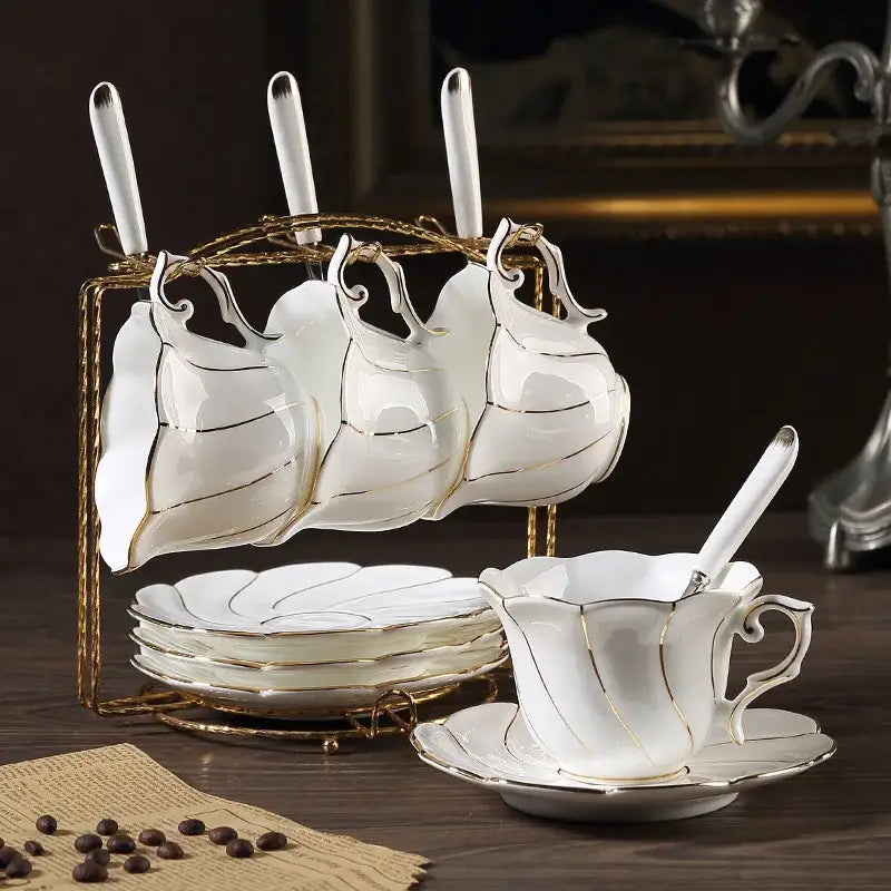 White bone china gold wave cup set with gold trim displayed on a golden stand for dining room decorbites gold wave tea set