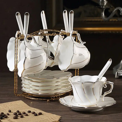 Elegant white bone china cup set with gold wave trim and leaf-shaped cups featuring decorbites gold wave design