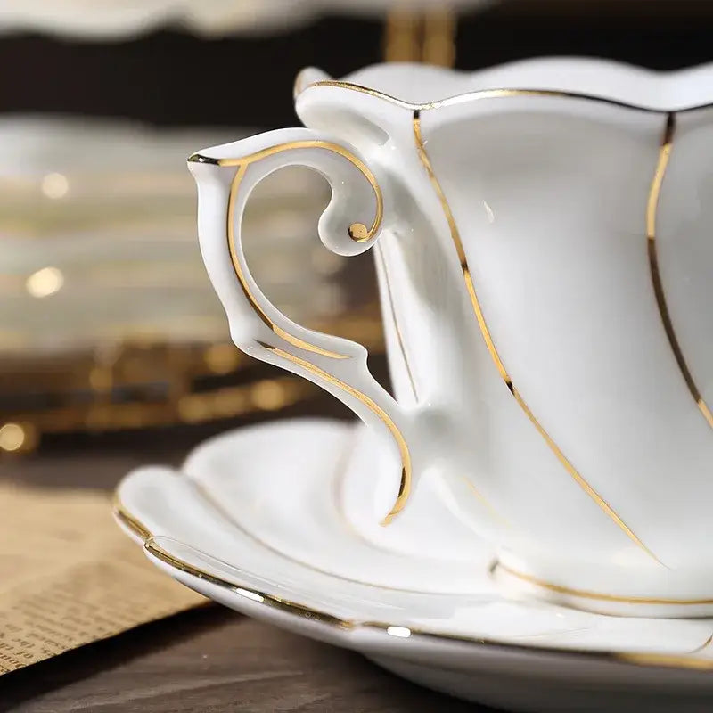 Elegant white bone china cup set with gold wave detailing by decorbites for refined dining room porcelain tea use