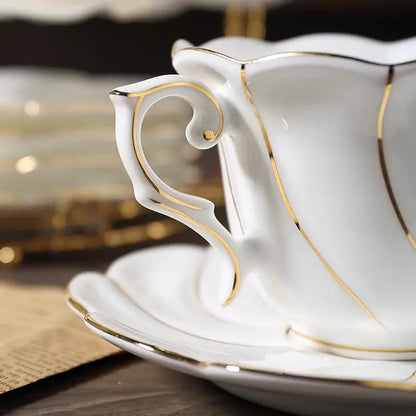 Elegant white bone china cup set with gold wave detailing by decorbites for refined dining room porcelain tea use
