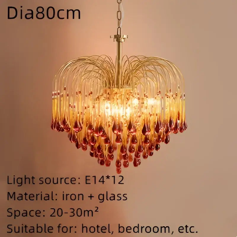 Golden heart-shaped chandelier with cascading amber and red crystal water drop glass pendants for dining room light