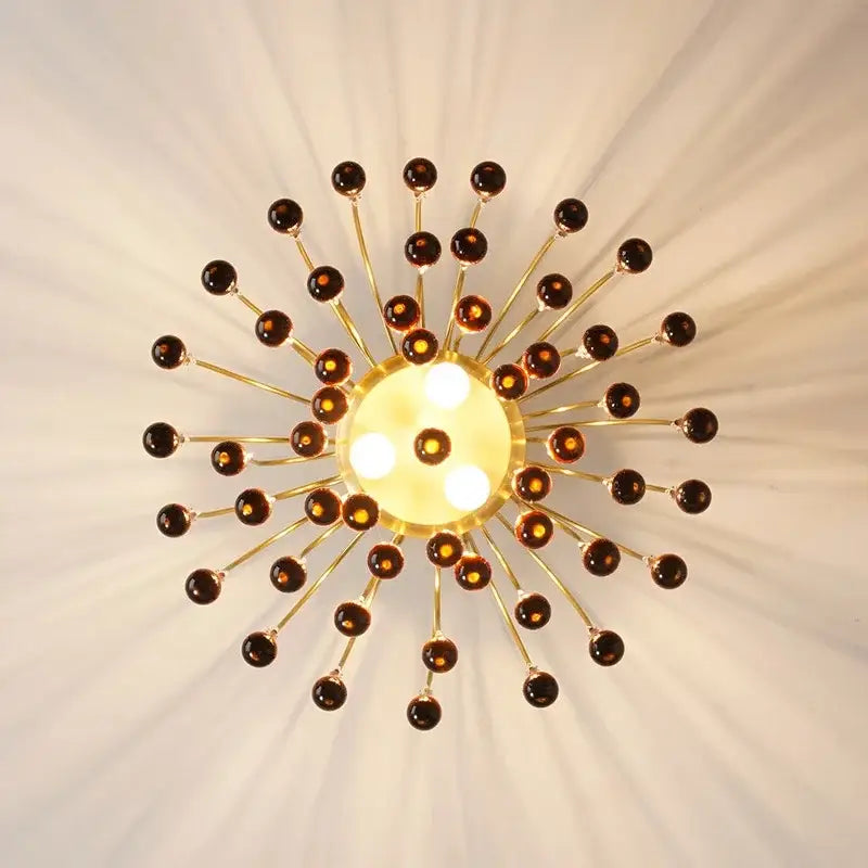 Golden amber crystal water drop chandelier with sunburst ceiling light design and amber glass orbs for dining room