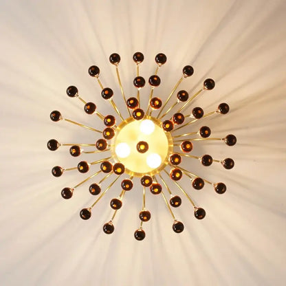 Golden amber crystal water drop chandelier with sunburst ceiling light design and amber glass orbs for dining room