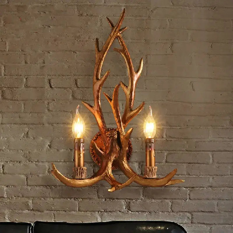 Golden antler deer horn wall lamp with two lit candle-style bulbs for living room decorbites deer horn decor