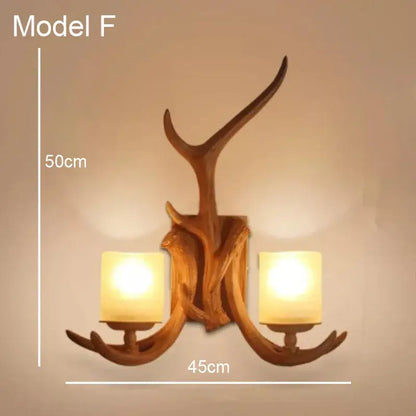 Golden antler deer horn wall lamp with two warm glass shades and rustic wooden finish for living room decorbites deer horn