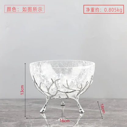 A clear crackled glass fruit plate with a silver-toned antler metal base dining room centerpiece bowl