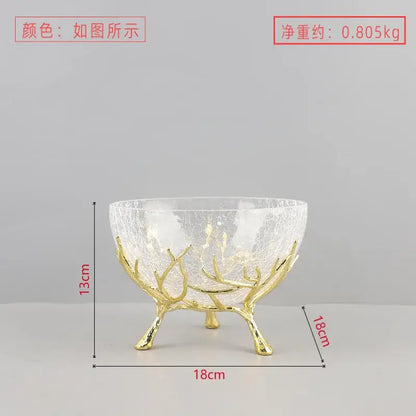 A clear crackled glass fruit plate with a golden antler base ideal as a dining room centerpiece bowl