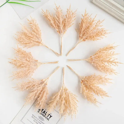 Beige dried pampas grass stems arranged in a circle in golden artificial autumn branches set for living room decorbites artificial autumn