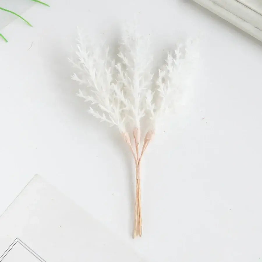 Golden artificial autumn branches set with delicate white feathery foliage and rose-gold stem base for decorbites artificial autumn decor