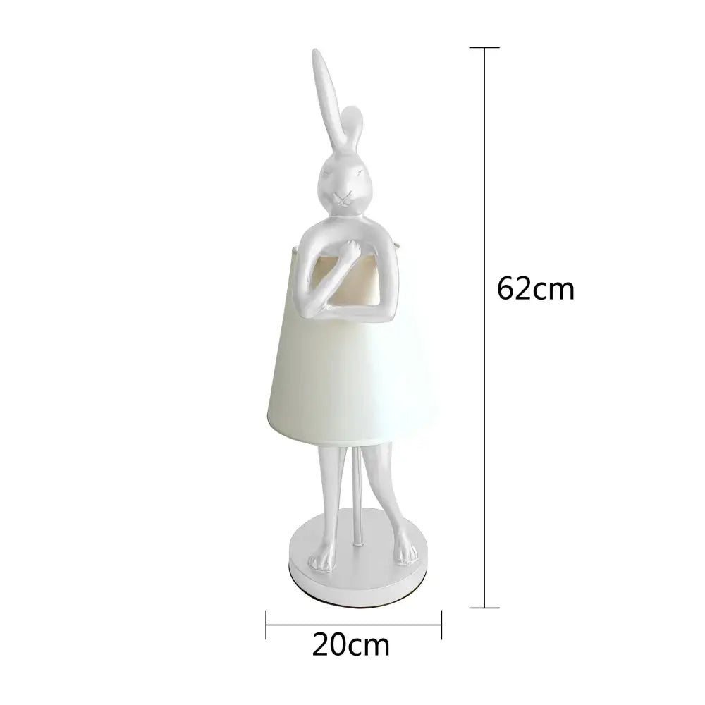 White ceramic bathing rabbit resin table lamp with cream conical shade and slender legs for decorbites bedroom decor