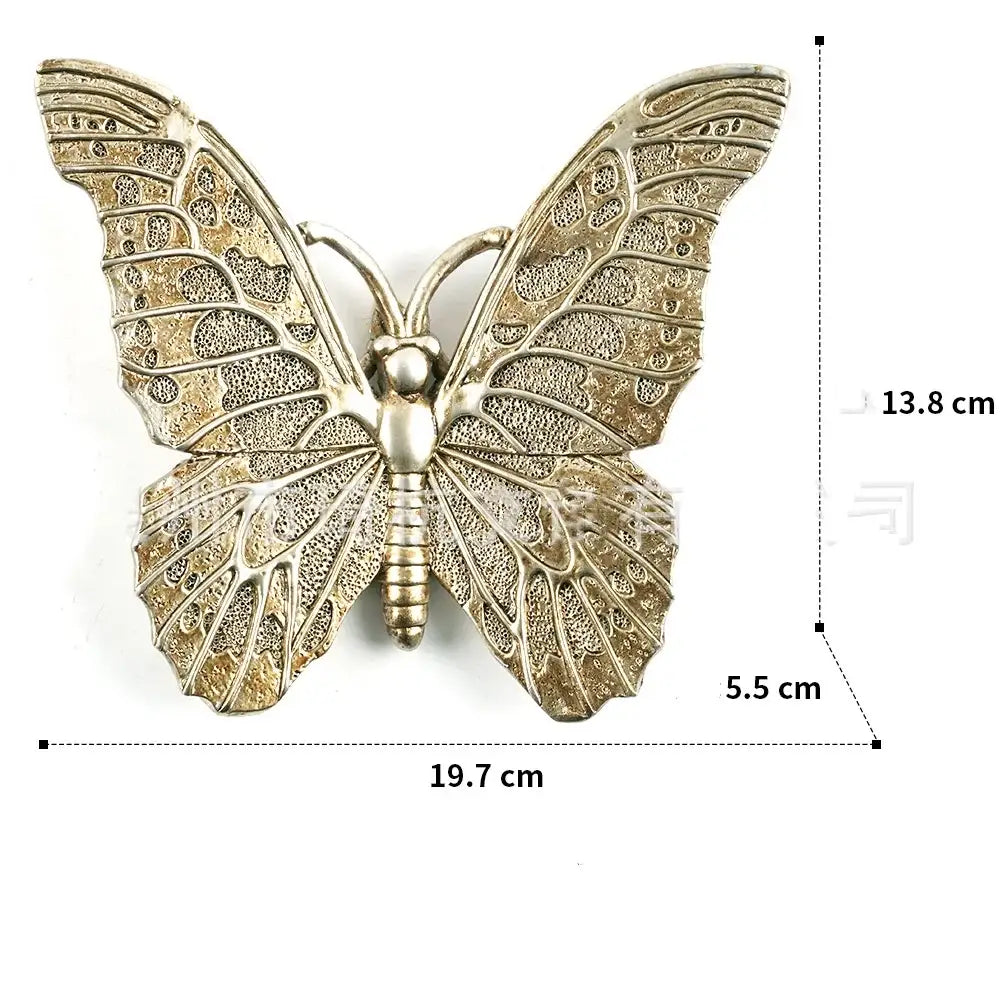 Antique gold-toned metal butterfly wall decor with intricate lace-like wings in decorbites golden bird butterfly resin wall collection