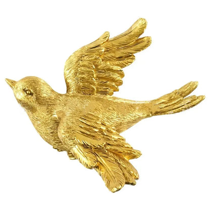 Golden bird brooch with detailed feather texture and polished metallic finish for decorbites golden bird butterfly resin wall decor