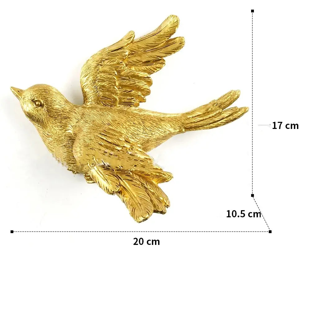 Golden bird figurine with detailed feather texture and outstretched wings in decorbites golden bird butterfly resin wall decor