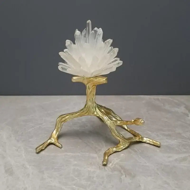 Translucent white quartz crystal cluster on a golden bird metal branch sculpture for living room decor