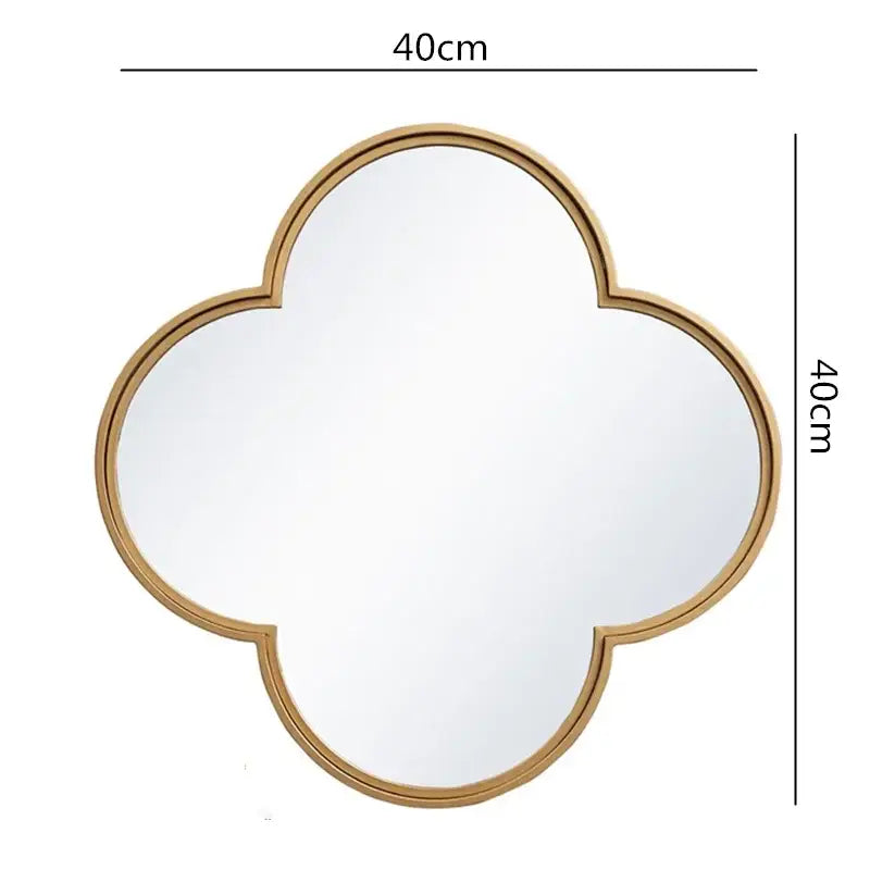 A 40cm square quatrefoil geometric plum flower mirror with a sleek golden border metal frame for living room decor