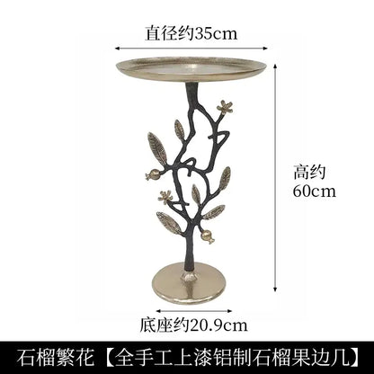 Golden brass bird tree side table with decorative brass bird base featuring leaves and pomegranates for living room decorbites brass bird