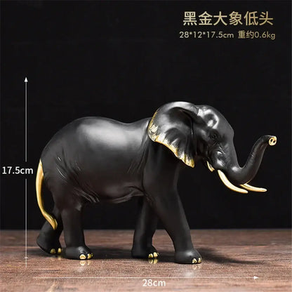 Black elephant resin sculpture with gold accents on ears trunk tip and feet for living room decor decorbites elephant resin
