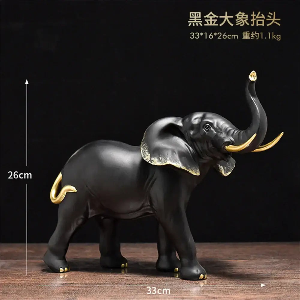 Black and gold decorbites elephant resin sculpture with glossy finish and detailed golden accents for living room decor