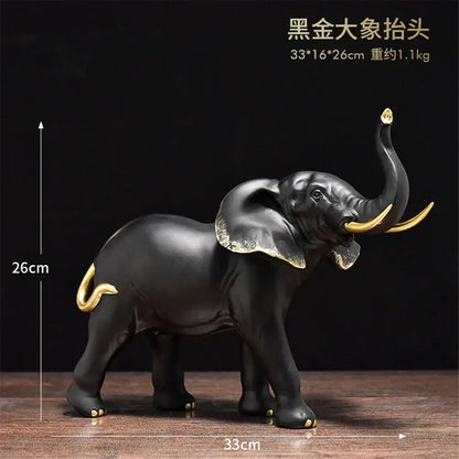 Black and gold decorbites elephant resin sculpture with glossy finish and detailed golden accents for living room decor