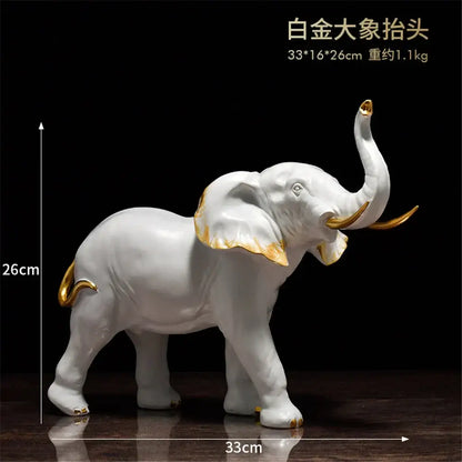 White porcelain elephant resin sculpture with gold accents by decorbites for elegant living room decor