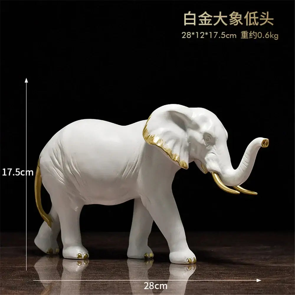 White ceramic elephant resin sculpture with gold accents for living room decor by decorbites elephant resin
