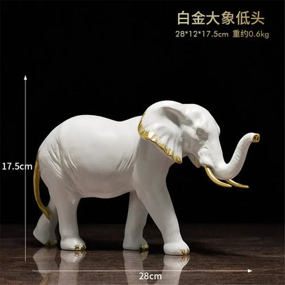 White ceramic elephant resin sculpture with gold accents for living room decor by decorbites elephant resin