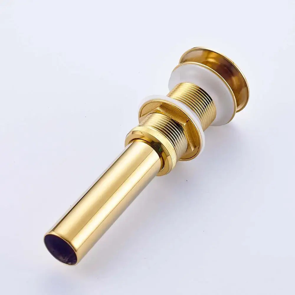 Golden brass vintage bathroom sink pop up drain in gold-toned metal with white ceramic accents for decorbites golden brass collection