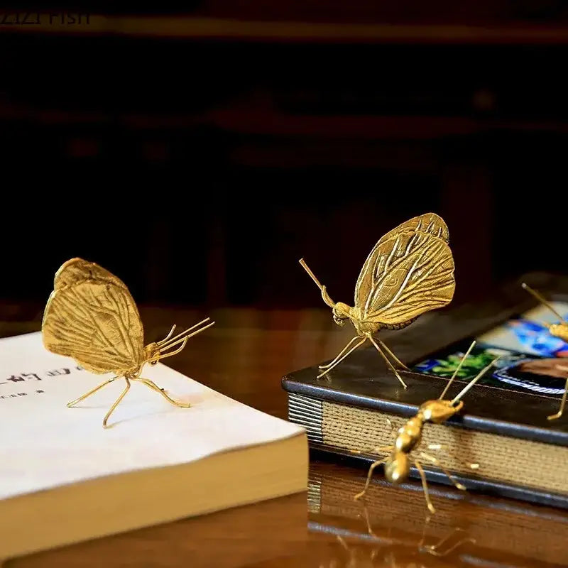 Golden butterfly ant miniature metal figurine with intricate wing patterns for elegant living room decor