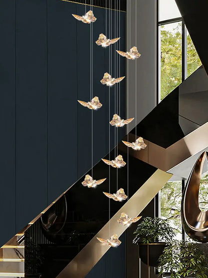 Golden butterfly chandelier pendant lights suspended from the ceiling ideal for butterfly chandelier staircase decor