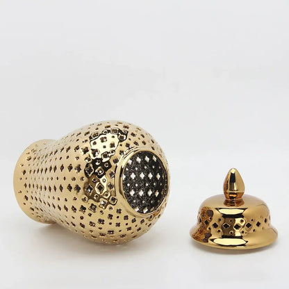 Golden ceramic ginger jar with intricate geometric cutouts and matching lid for home decor by decorbites golden ceramic