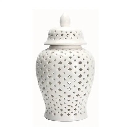 White ceramic ginger jar with matching lid and diamond-shaped cutouts for decorbites golden ceramic home decor