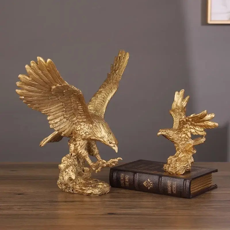 Golden dapeng eagle wings resin statue with detailed feather texture in dynamic pose on rocky base for office decor