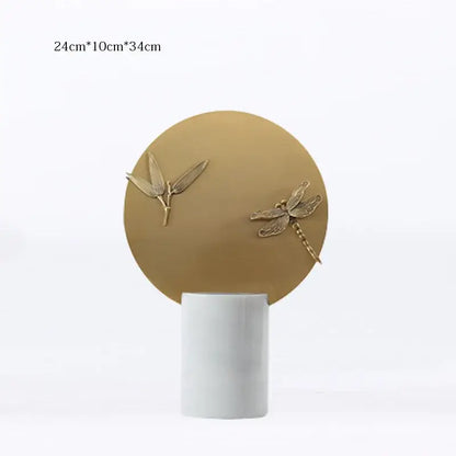Gold-toned dragonfly and leaf figurine set on a matte white base for home decor by decorbites golden geometric