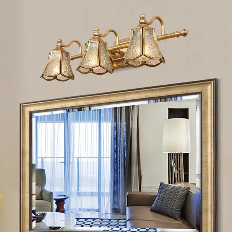Gold-toned decorbites golden glass mirror cabinet light with three ornate crackled bell-shaped glass shades for vanity use