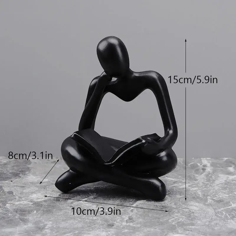 Black glossy resin figurine of a seated thinker with hand on chin for decorbites abstract thinker resin office decor