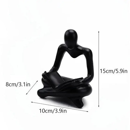 Black glossy resin figurine of a seated human reading a book for decorbites abstract thinker resin office decor