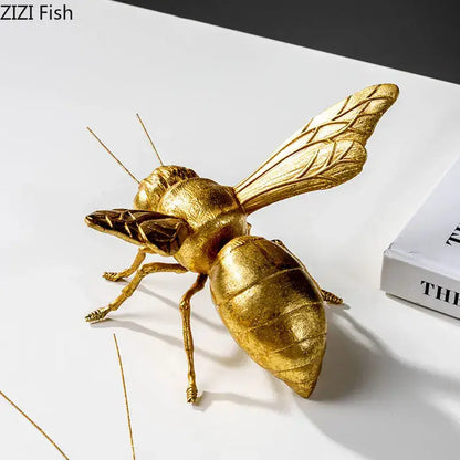Golden honeybee insect statue with detailed segmented body and metallic finish for living room decorbites decor
