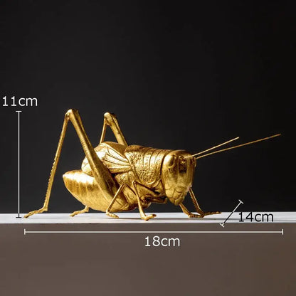 Golden metallic grasshopper insect statue with intricate lifelike textures and articulated limbs for decorbites golden honeybee decor