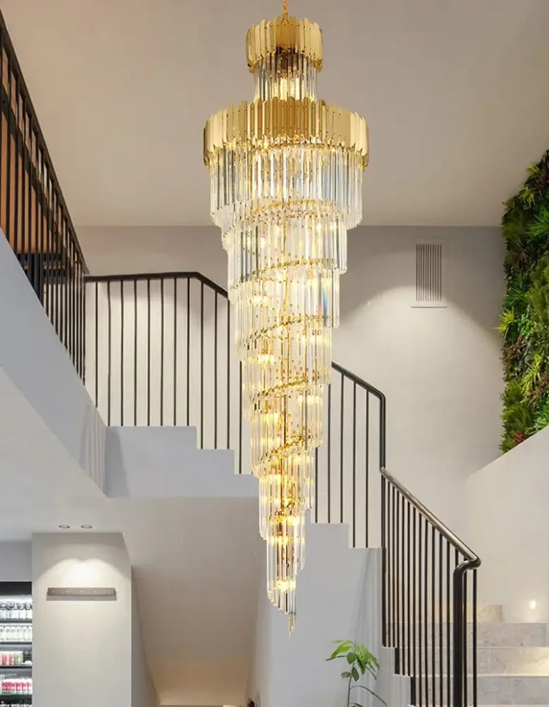 Golden luxury spiral crystal chandelier with cascading crystal tiers designed for elegant staircase decorbites golden luxury
