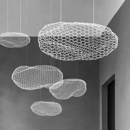 White honeycomb-patterned cloud-shaped pendant light by decorbites cloud light for warm nordic designer pendant decor
